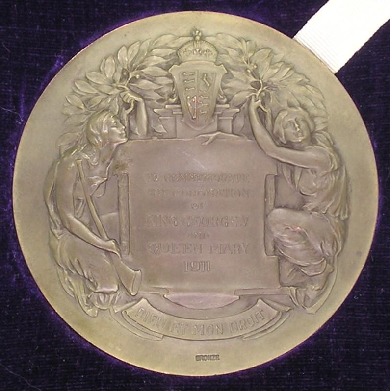 MINT CASED 1911 CORONATION MEDALLION, PRESENTED TO ALDERMAN C.H.WILSON OF LEEDS, THE ORIGINAL QUARTERMASTER OF THE LEEDS PALS 1914