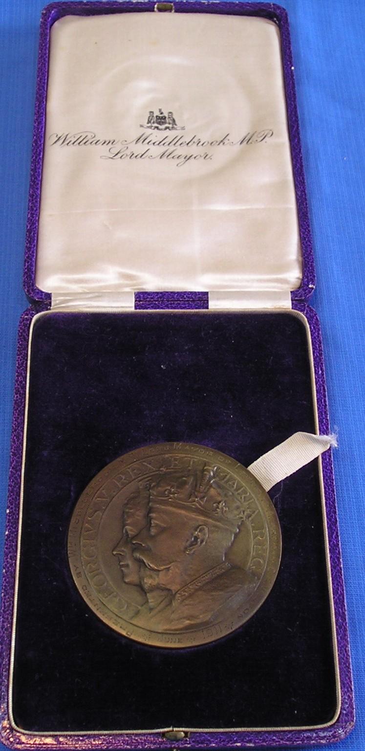 MINT CASED 1911 CORONATION MEDALLION, PRESENTED TO ALDERMAN C.H.WILSON OF LEEDS, THE ORIGINAL QUARTERMASTER OF THE LEEDS PALS 1914